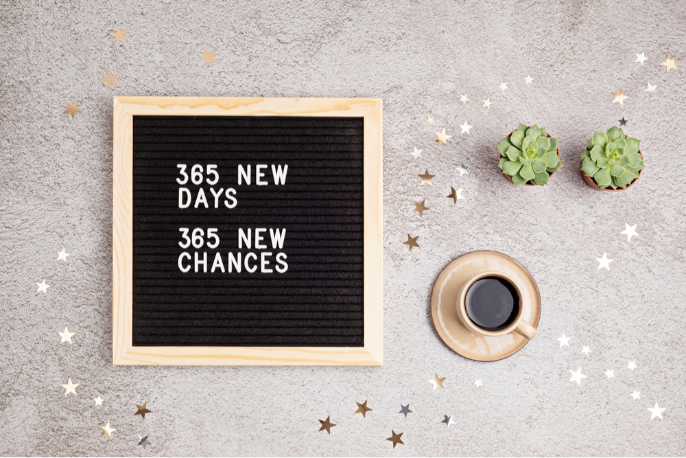 A sign reads, 365 new days, 365 new chances