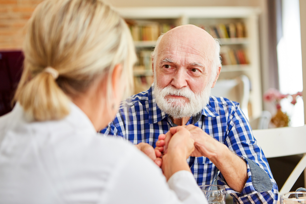 An older man is evaluated for dementia in a medical setting
