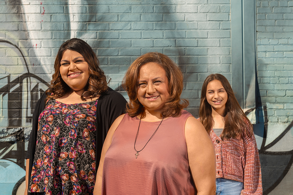 Christine Ysabal, center, pictured with daughters Samantha and Isabella