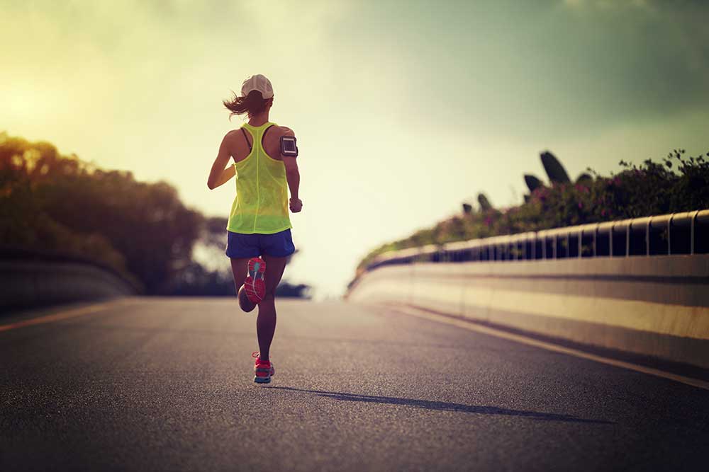 woman running down street