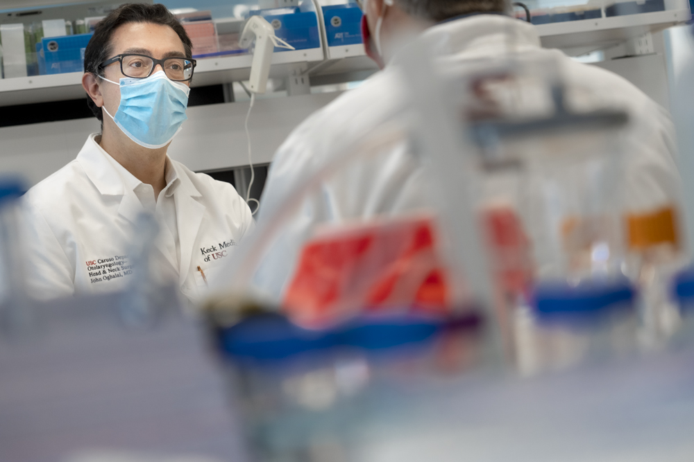 Dr. John Oghalai, working in a lab