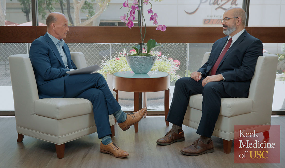 Rod Hanners, CEO of Keck Medicine of USC, talks with Jorge Nieva, MD, a medical oncologist with Keck Medicine.