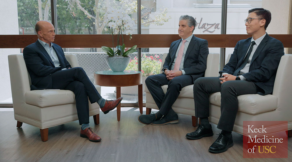 Rod Hanners, CEO of Keck Medicine of USC, talks with Fernando Fleischman, a cardiothoracic surgeon, and Sukgu Han, a vascular surgeon with Keck Medicine.