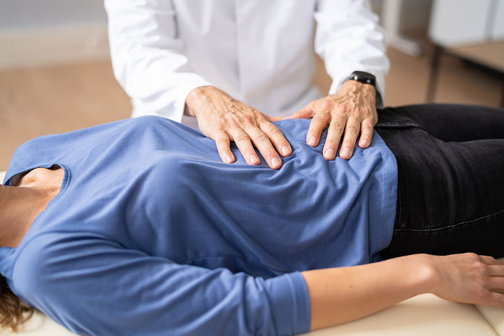 A gastroenterologist examines a patient with inflammatory bowel disease, or IBD.