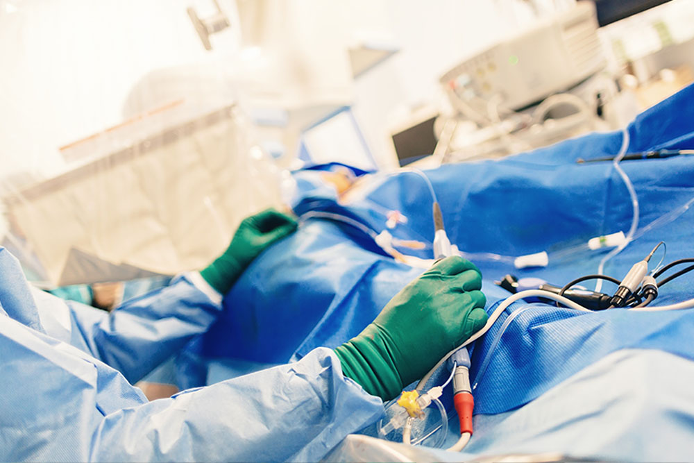 Physicians in the OR apply ablation to a patient’s heart to treat atrial fibrillation.